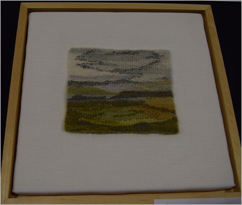  Lisa Mitchell received the Best Weaving Award for her woven picture; she used a cotton warp with a Lincoln/Merino weft. Photo: Peggy Lundquist.